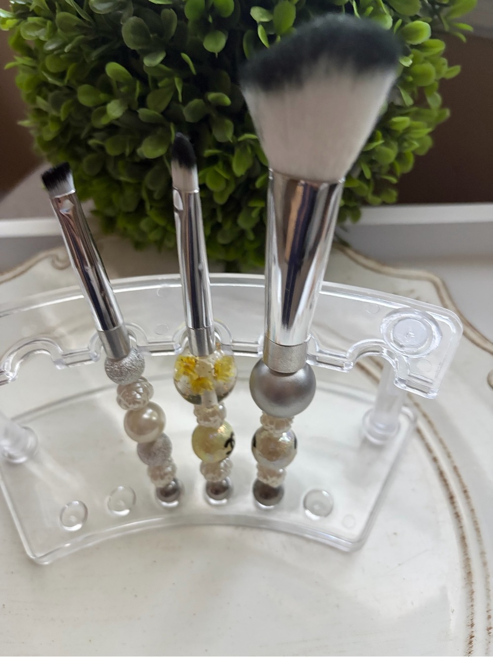 Bundle of beaded makeup brushes